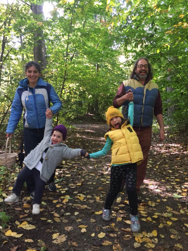 sarah and her family in the woods